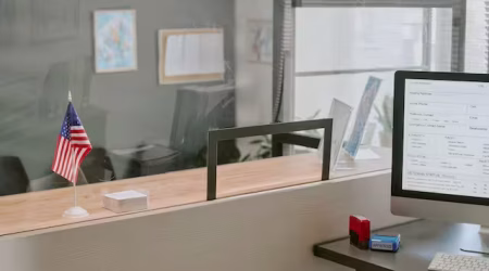 office-desk-with-computer-and-american-flag-displa-2025-08-11-16-37-20-utc