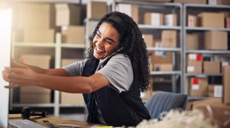 phone-call-warehouse-and-woman-on-computer-for-sh-2025-04-05-13-09-13-utc